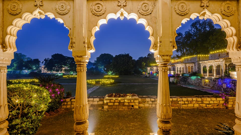 Carved arches overlooking the grounds at Deo Bagh
