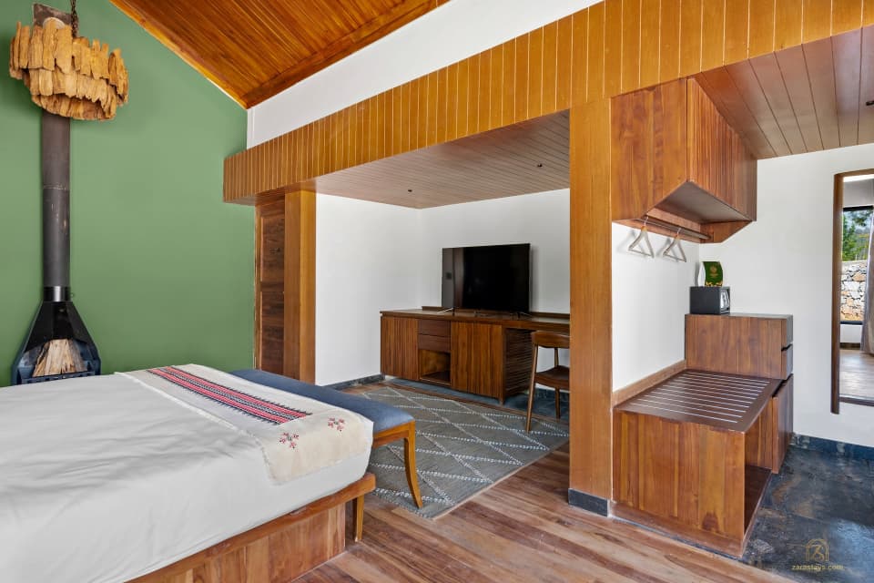 A chalet bedroom at WelcomHeritage Ayatana Ooty