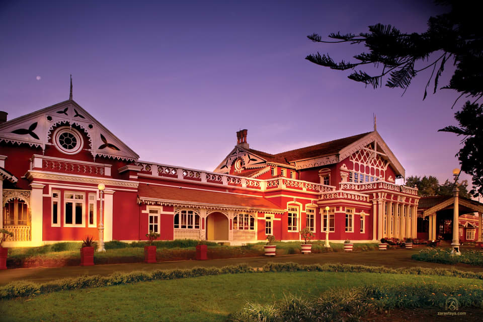Fernhills Royal Palace illuminated at dusk