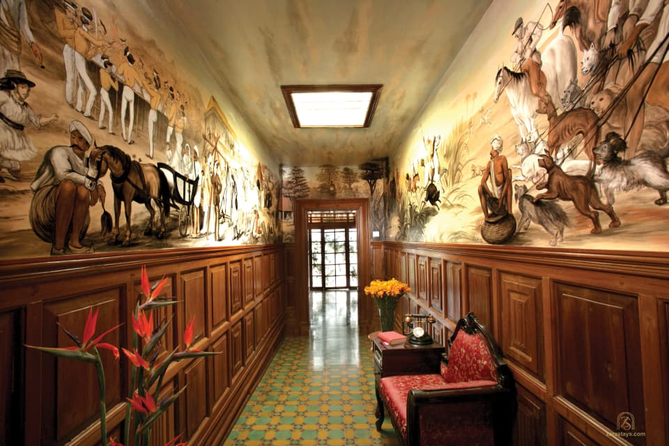 Historic artwork along a palace corridor