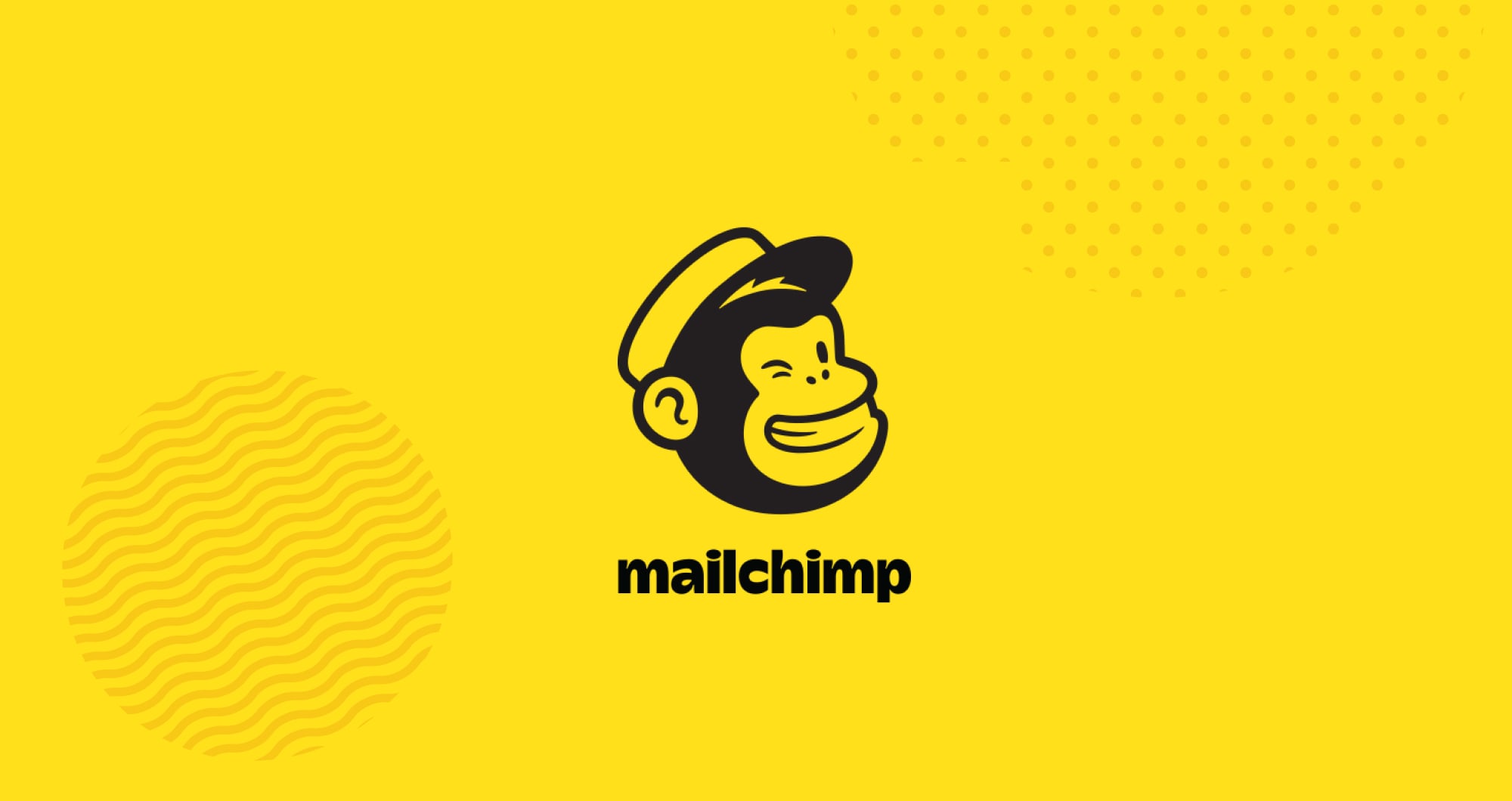 A yellow background with a monkey wearing a mailman's hat holding a piece of paper next to an email marketing tool called Mailchimp.