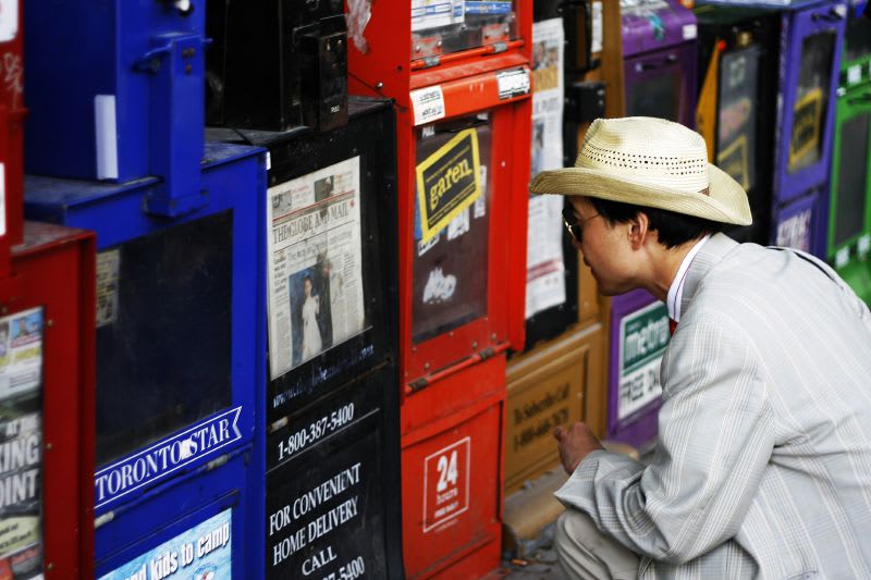 Man reading headlines