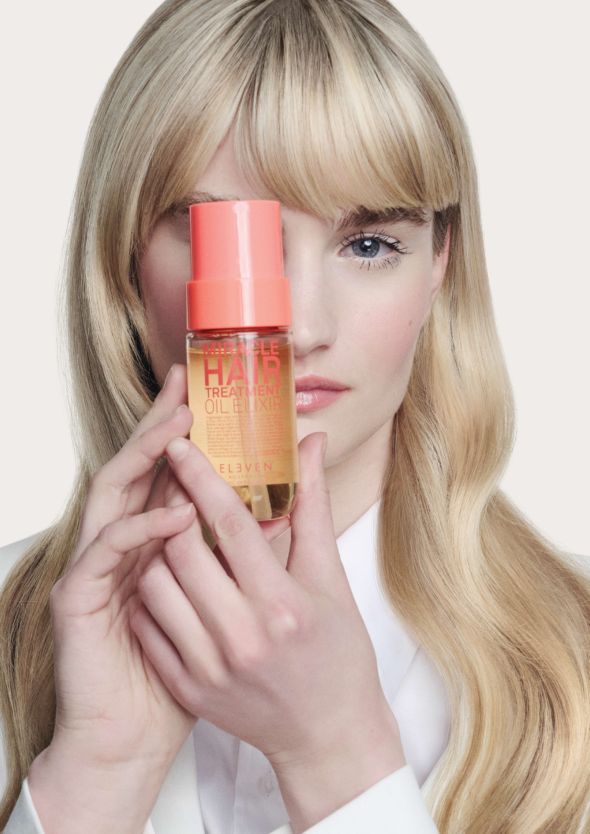 Miracle Hair Treatment Oil Elixir på grå bakgrunn