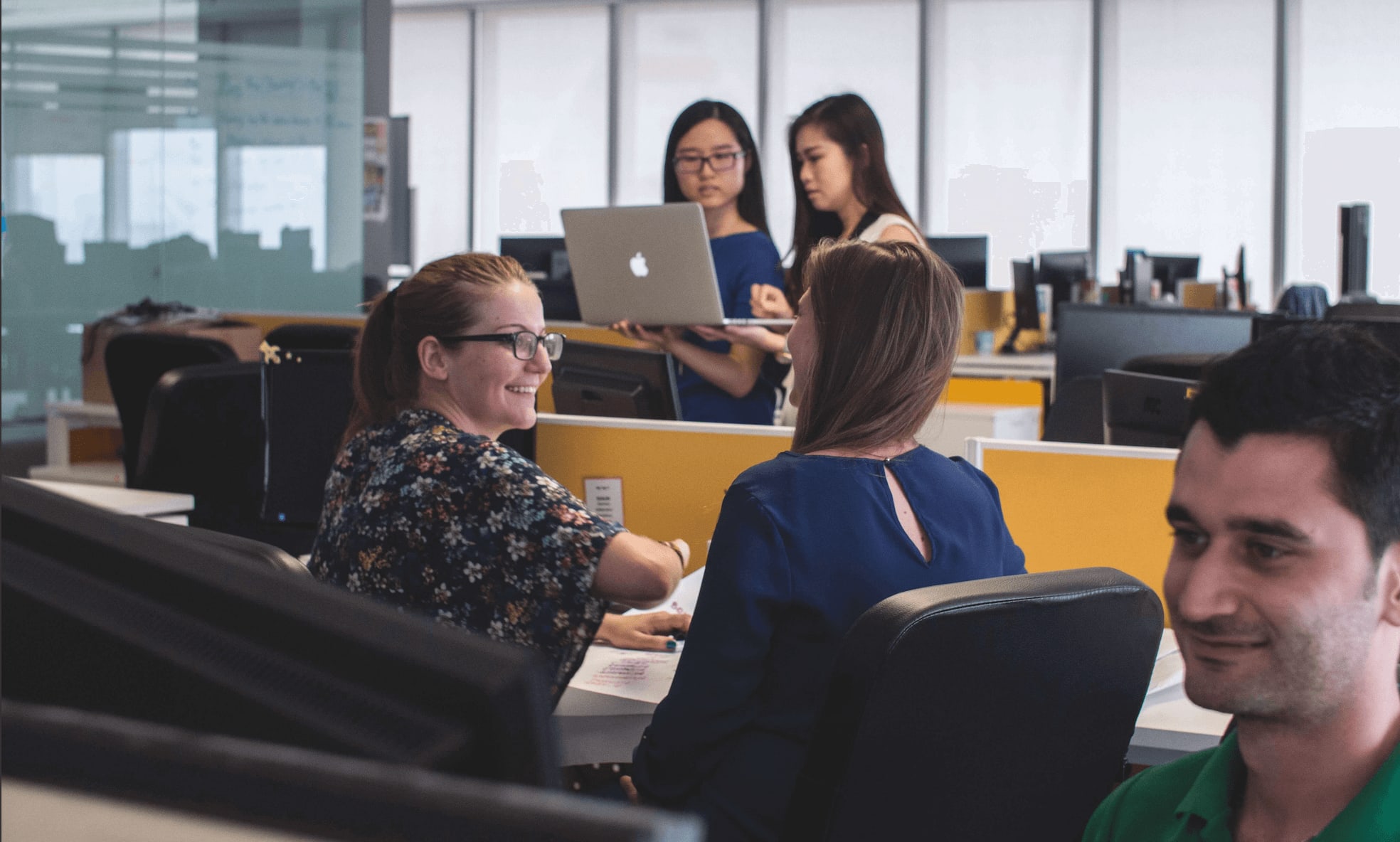 Group of co-workers in an open office