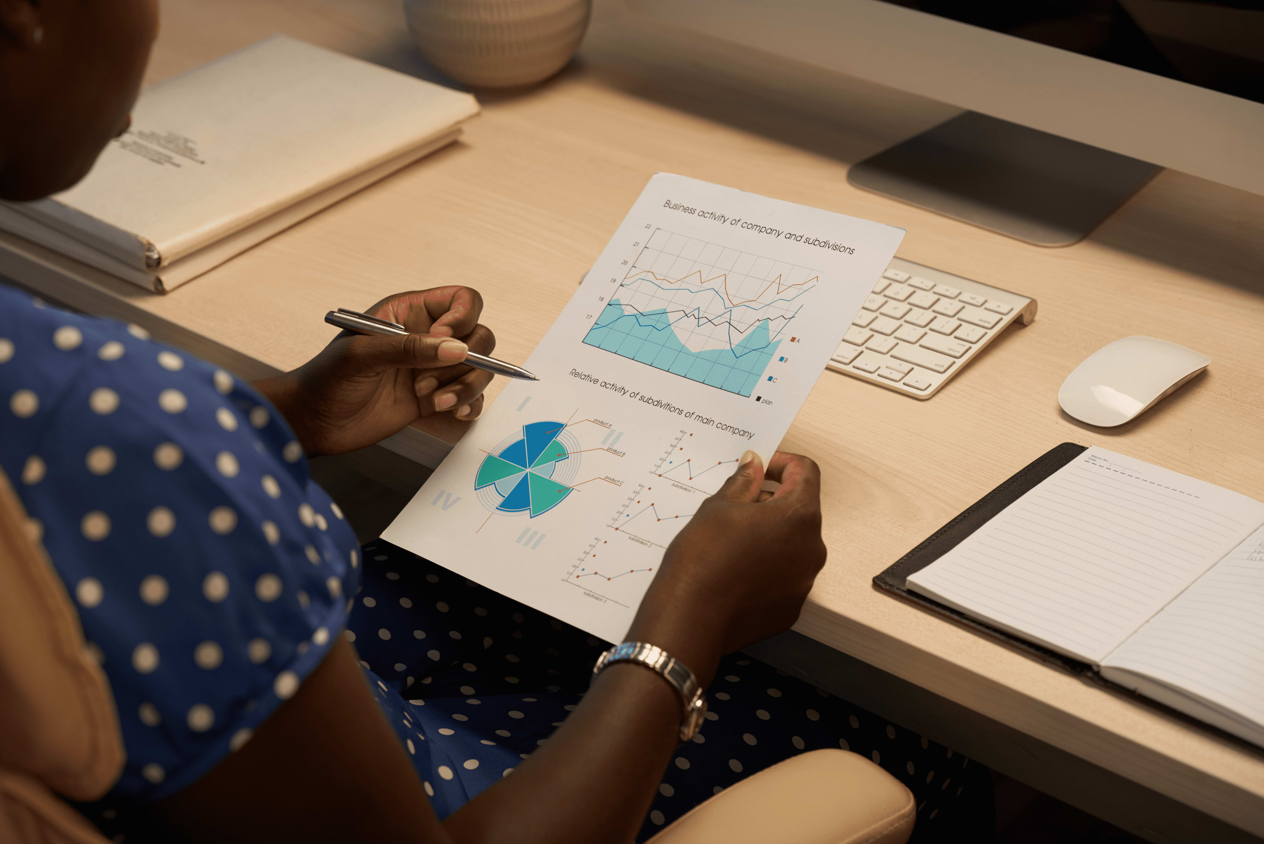 A woman reviewing business performance image from unsplash