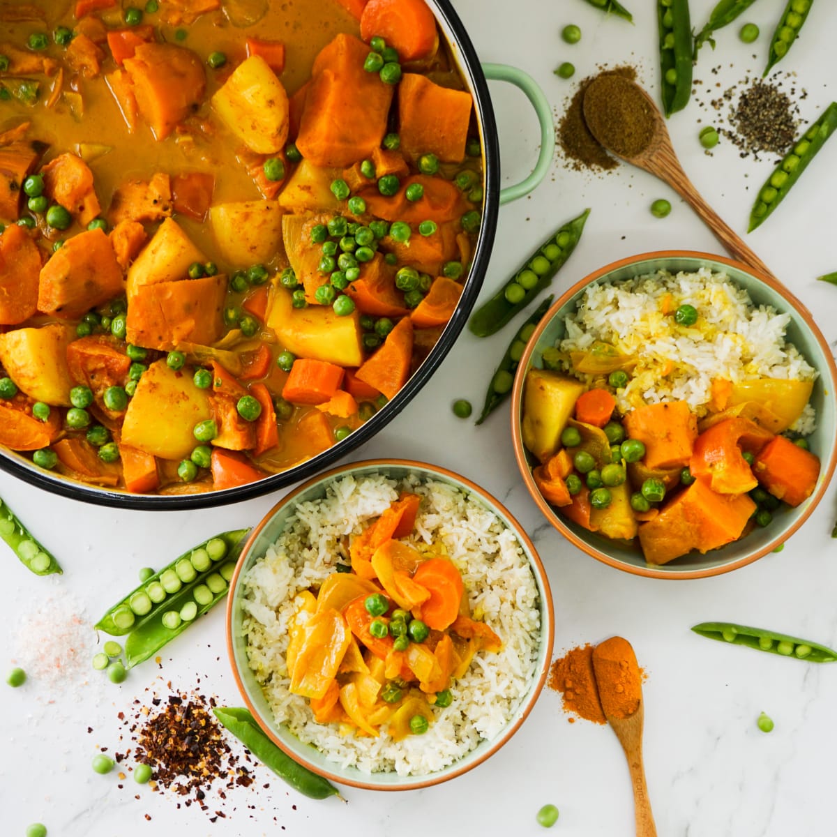 vegan yellow curry served with rice and quinoa