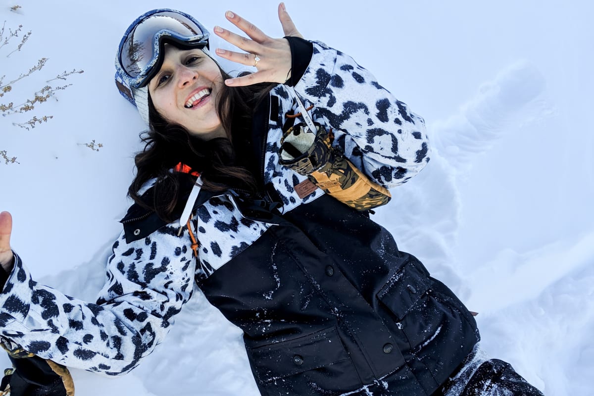 happy in the snow after the proposal