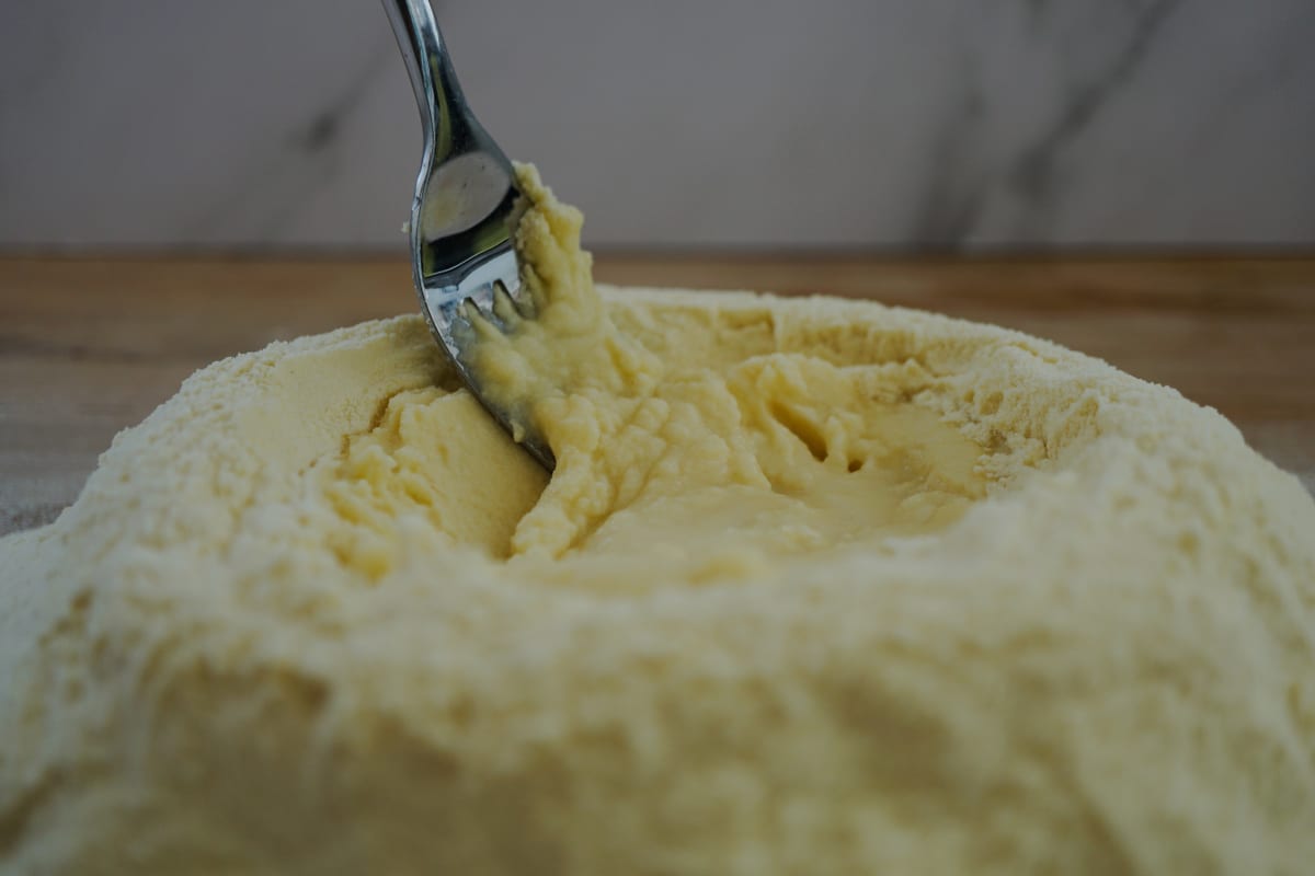 mixing pasta flour with water and olive oil