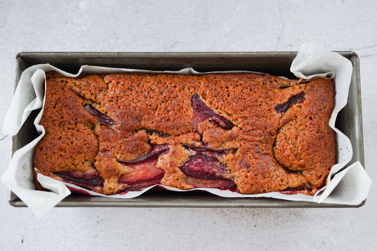 baked plum cake in the baking pan