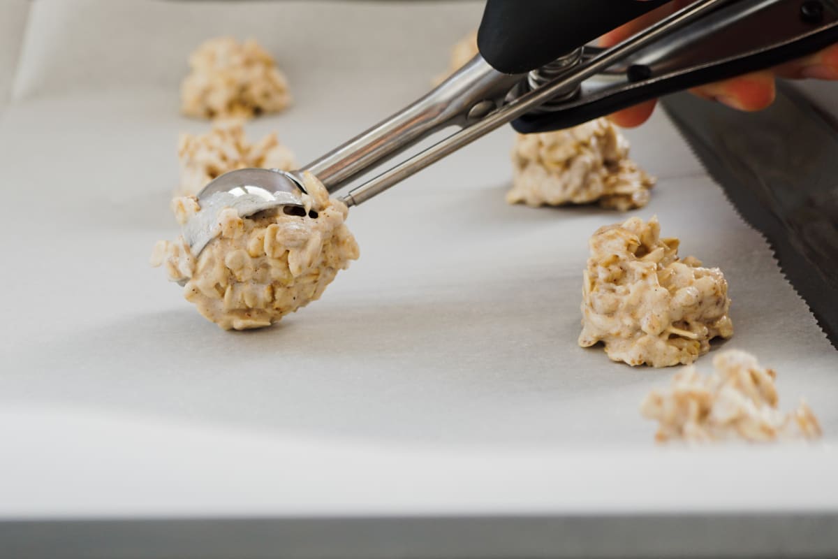 scooping cookies onto the tray