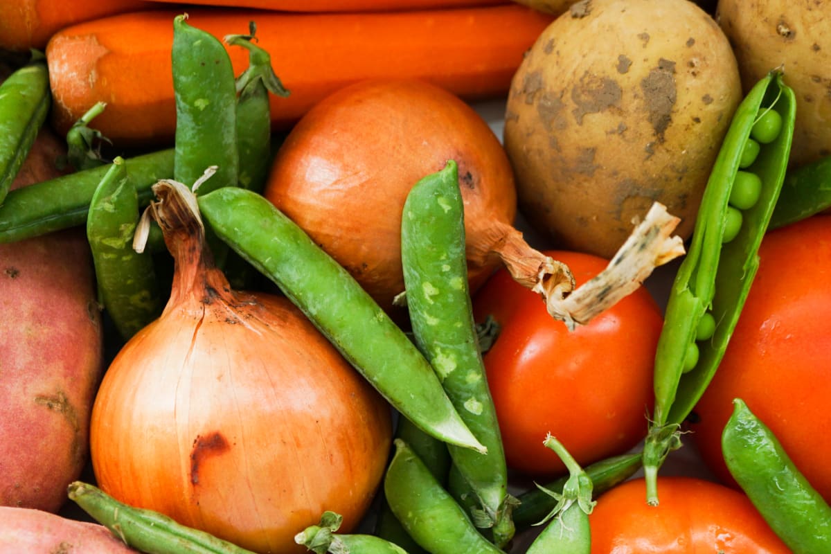 curry vegetables - potatoes, tomatoes, sweet potatoes, carrots, onions and peas