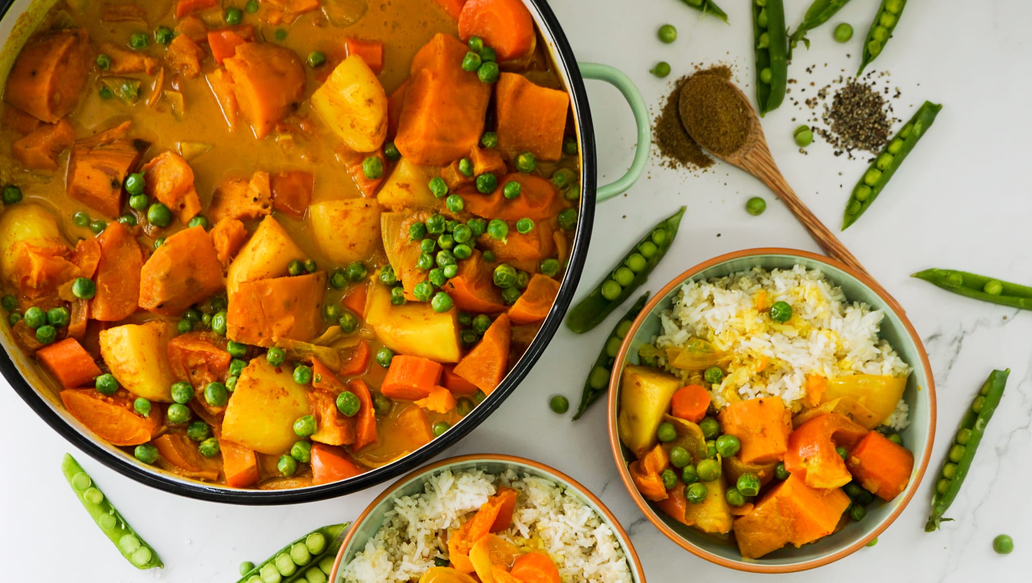 vegan yellow curry served with rice and quinoa