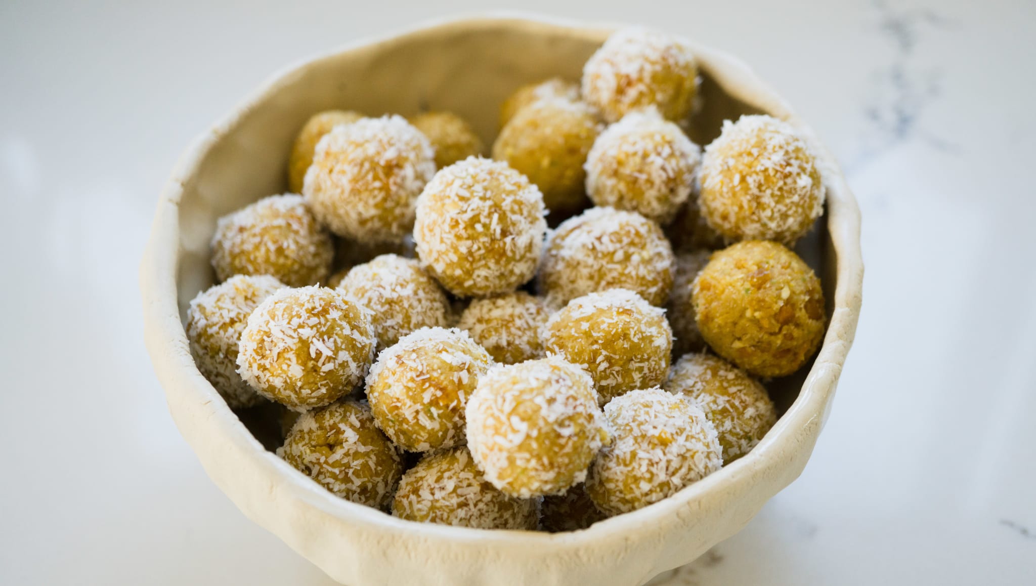 Mango Lime Coconut Protein Balls in a bowl