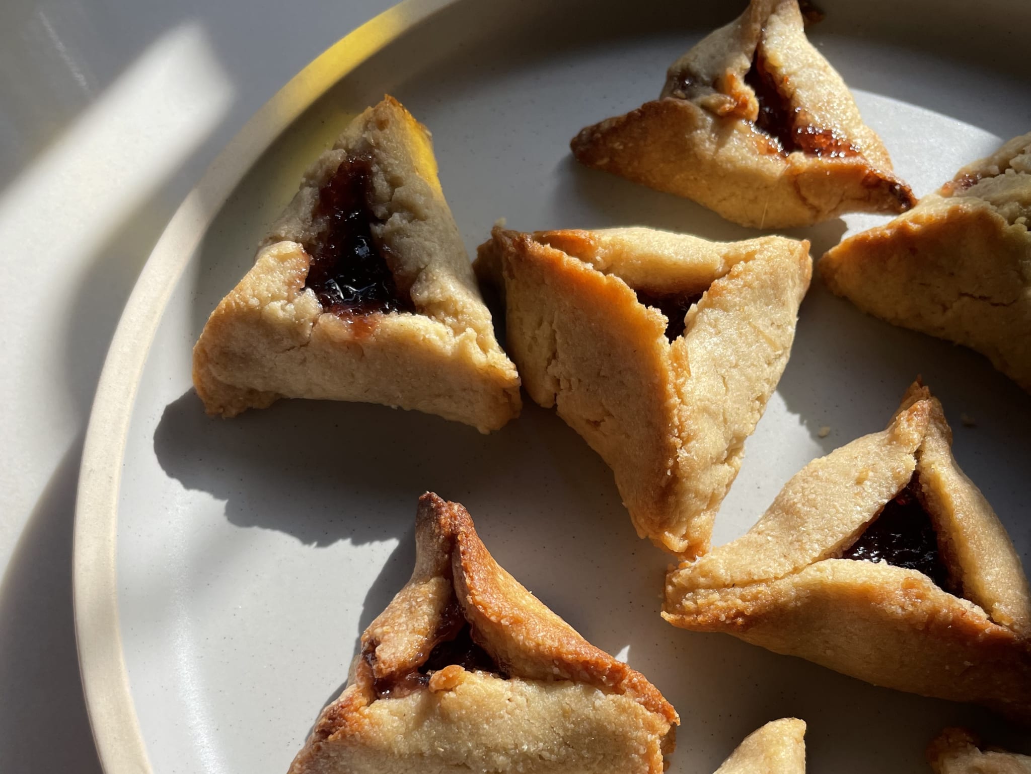 Vegan hamantaschen for Purim with strawberry jam 