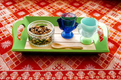 Transferring using a mini spoon | Via Montessori