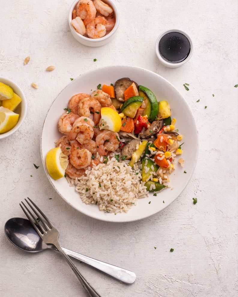 Nuestra sugerencia: Un wok de langostinos con vegetales.