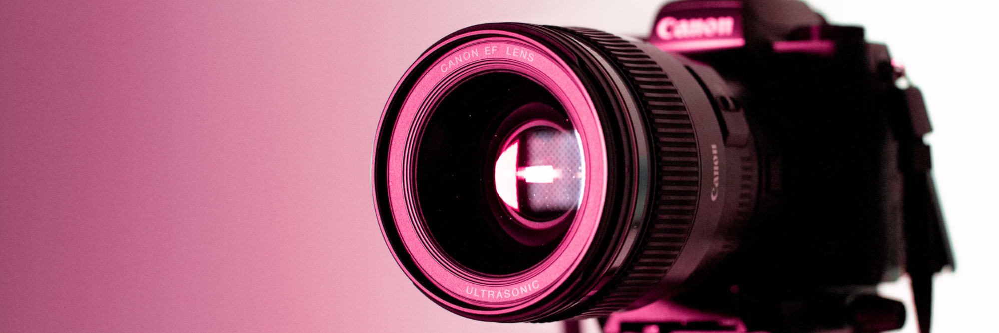 Professional portrait photography setup showing a photographer working with a model in a studio environment