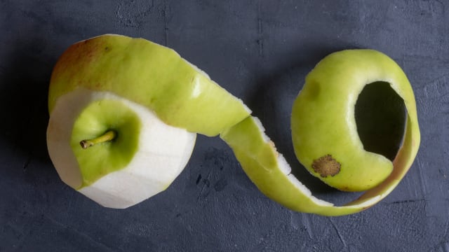 Fresh apples and leafy botanical ingredients