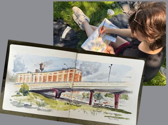 Artiste en train de dessiner à l'exterieur