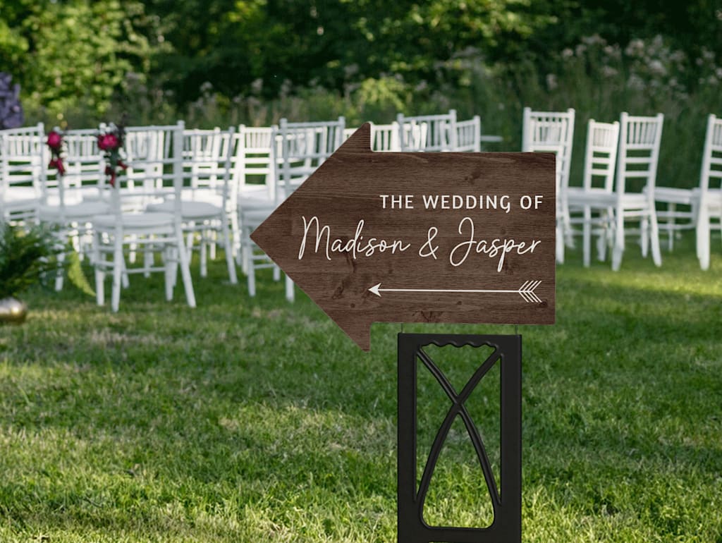 Directional wooden wedding sign shaped as an arrow