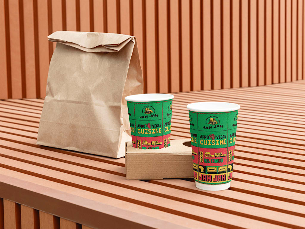 A food delivery bag and branded paper cups