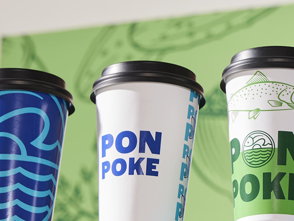 Branded paper cups with lids for takeaway hot drinks