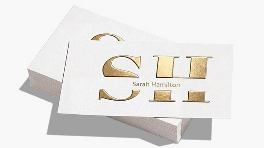 White business card with raised foil accents