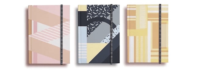 Three notebooks with geometric patterns.
