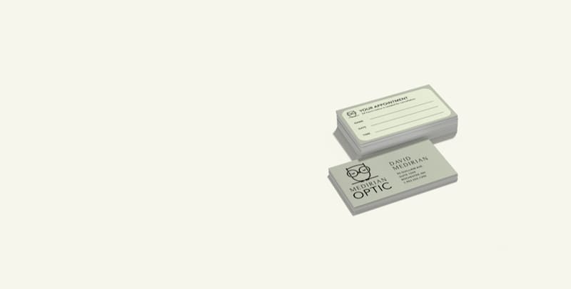 Two-sided slim business cards for Medirin Optic, with contact details on the front and an appointment reminder form on the back.