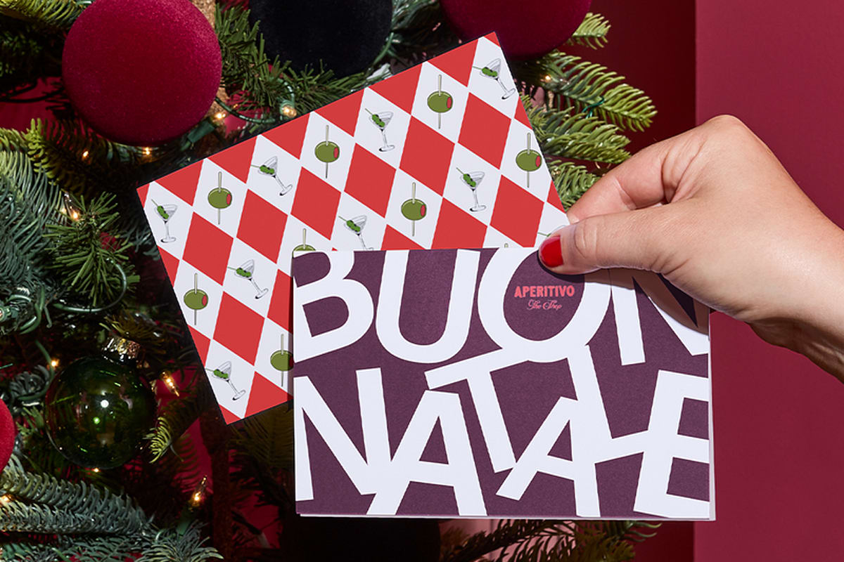 A branded Christmas card for business that features bold typography, small brand logo and a pattern that uses brand imagery