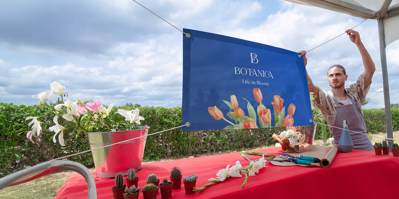 A blue vinyl banner for a florist company