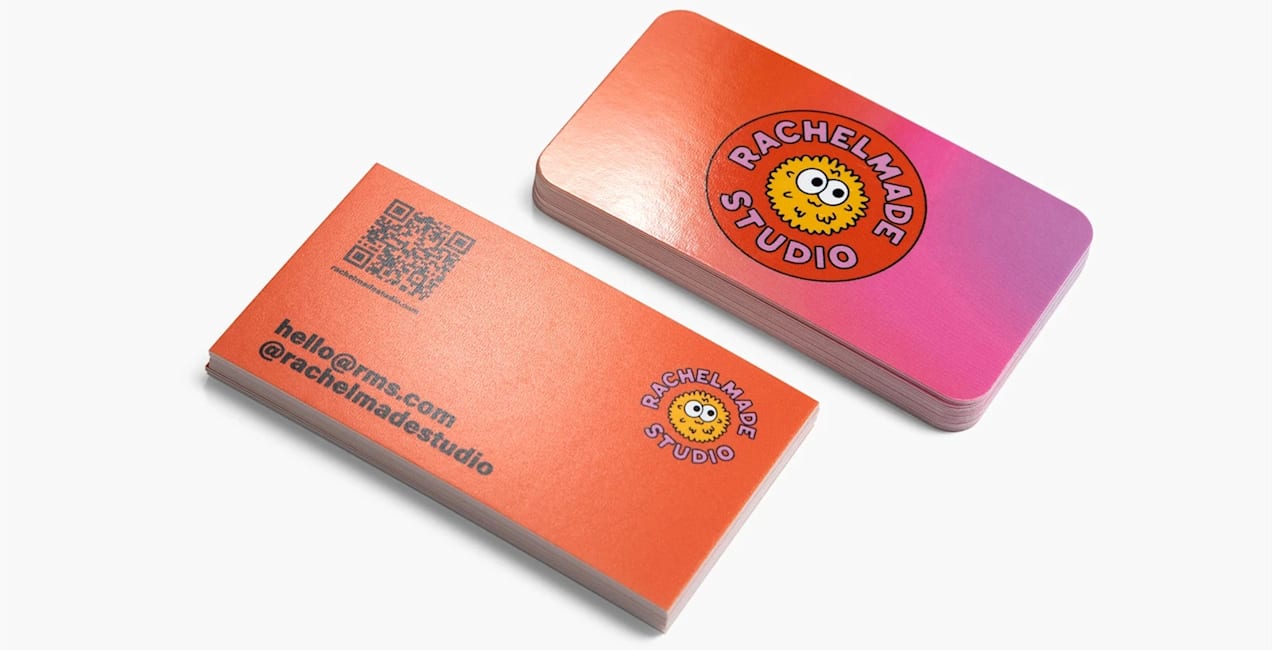 A colorful business card with a QR code, email address and social media handle