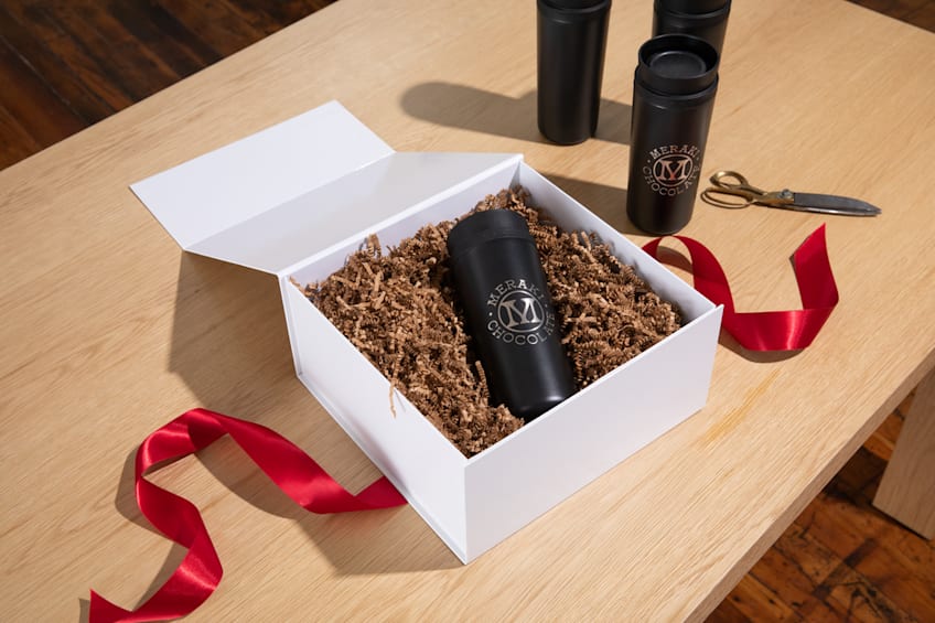 An insulated travel tumbler in a gift box, holiday gifting