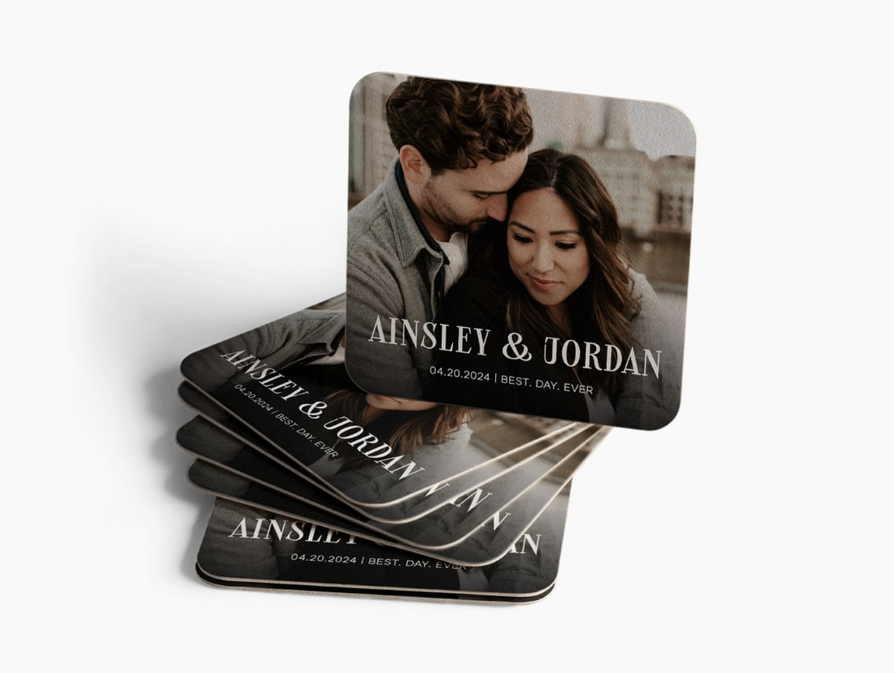 Small stack of save the date magnets with photo of the couple on them
