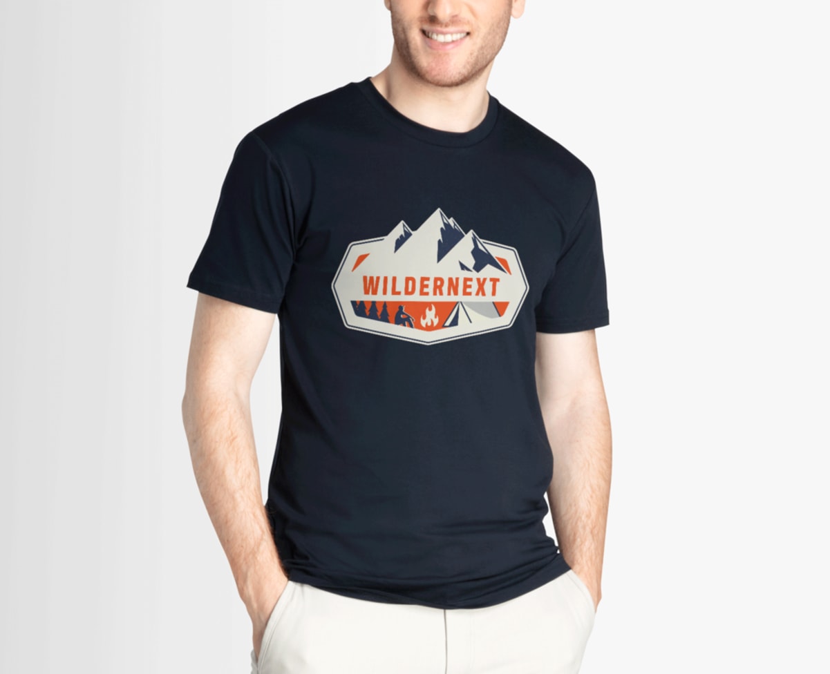 man wearing non-profit T-shirt with camping and mountain logo