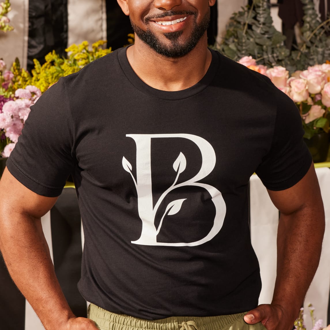 Man wearing T-shirt with plant shop logo