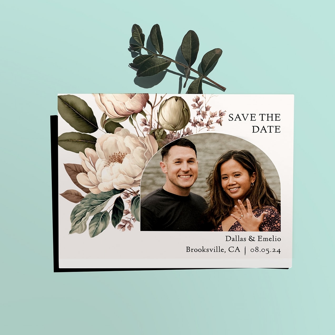 Example of save the date card with floral theme and photo of couple