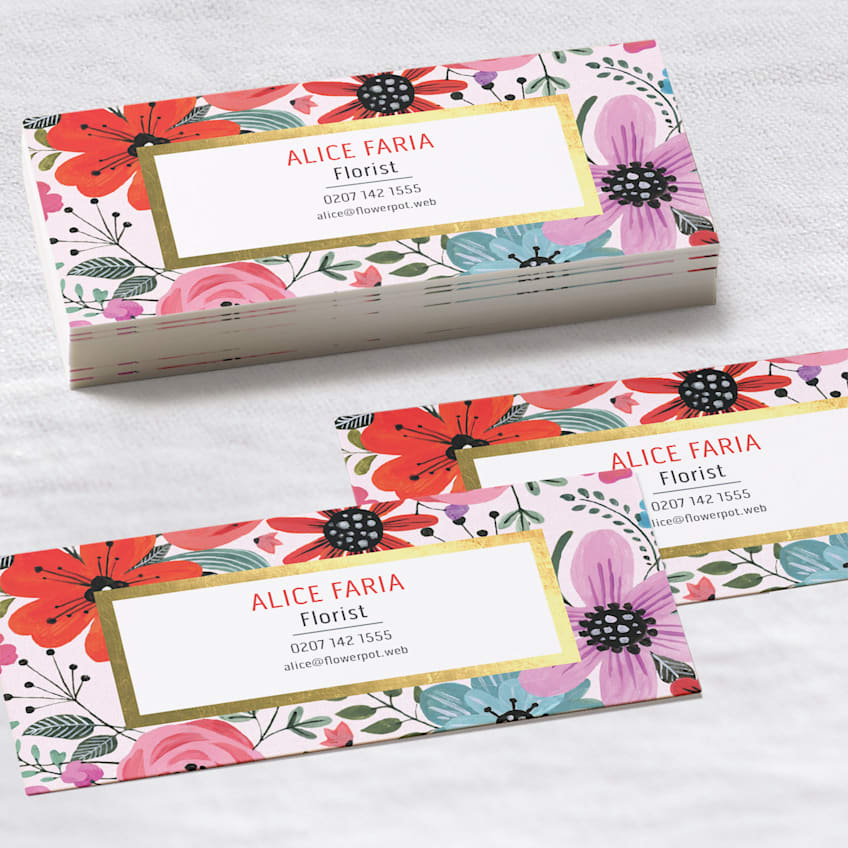 Floral mini business cards for a florist featuring colorful flowers, contact details and gold accents.