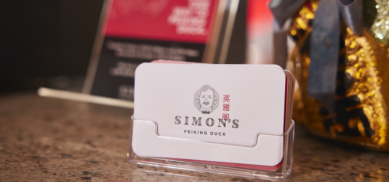 A stack of unique business cards in a restaurant