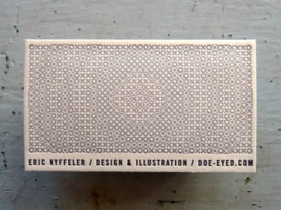 white and pale pink business card featuring an intricate pattern design