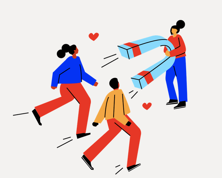 A woman points a giant magnet towards two other people