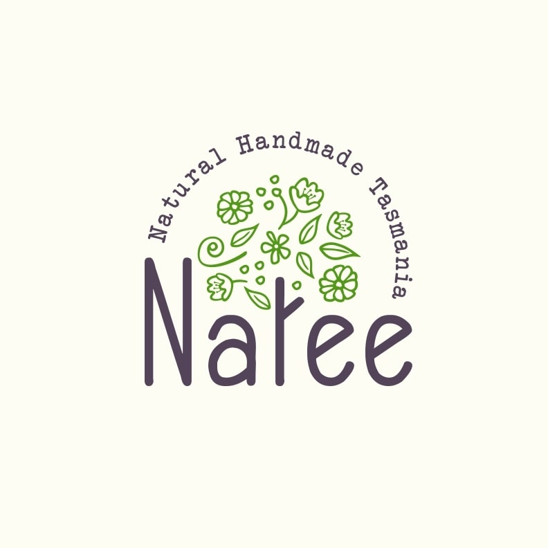 round logo with the letter &ldquo;t&rdquo; in &ldquo;Natee&rdquo; illustrated as a tree trunk with green leaves and flowers floating above it