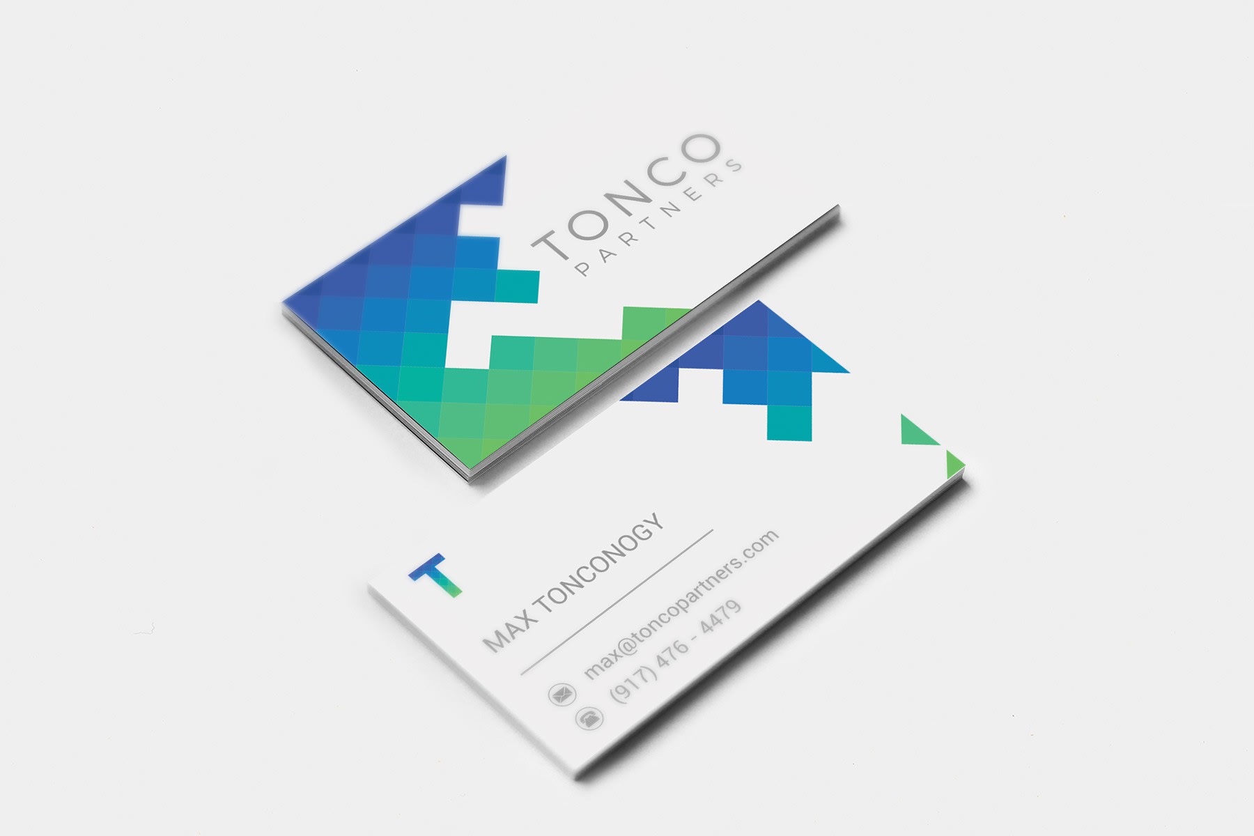 Real estate business card with green abstract polygon shapes