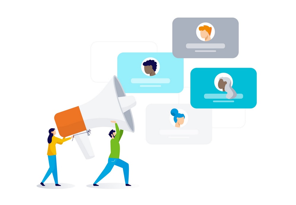 Two people hold up a giant megaphone