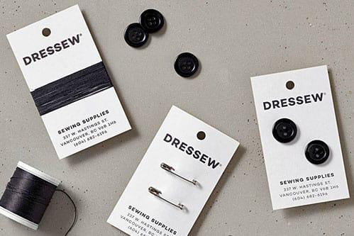 Business card for a sewing business that included thread and two buttons