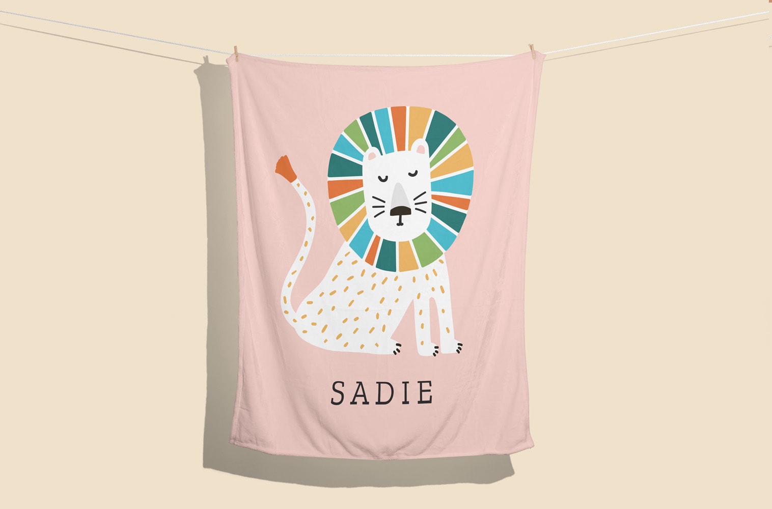 A personalized baby blanket with a lion illustration