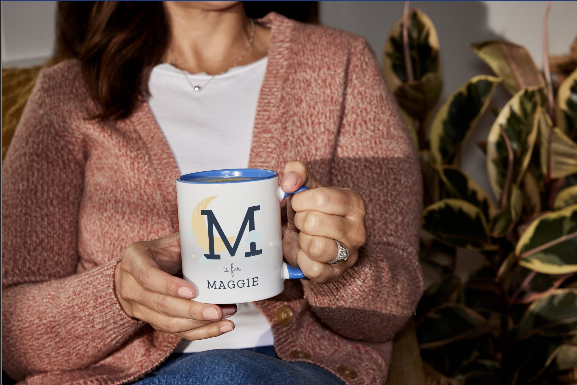 A custom mug with the baby’s initial