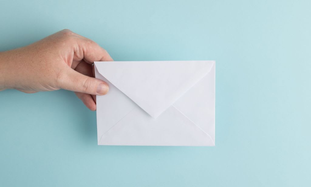 hand holding envelope