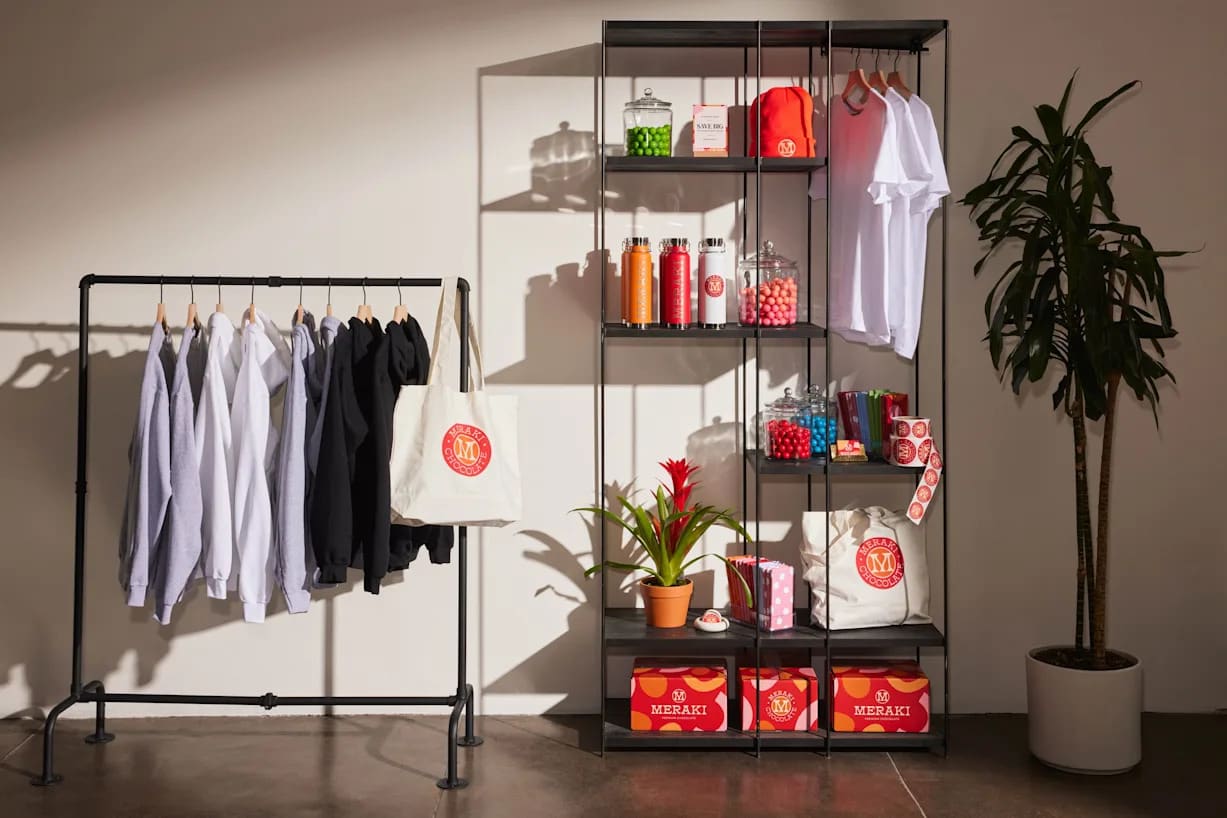 a clothing rack with hanging t shirts with custom designs