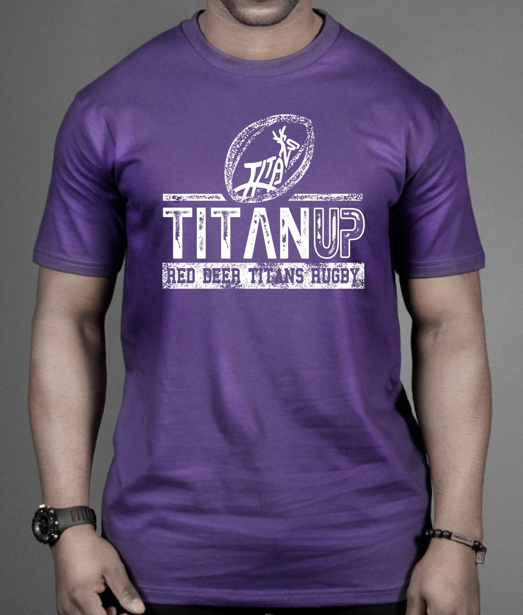 Man wearing a rugby shirt that reads &ldquo;TitanUp Red Beer Titans Rugby&rdquo;